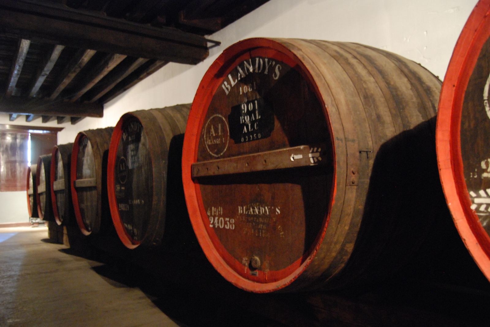 Madeira wine casks stacked in a cellar in Funchal