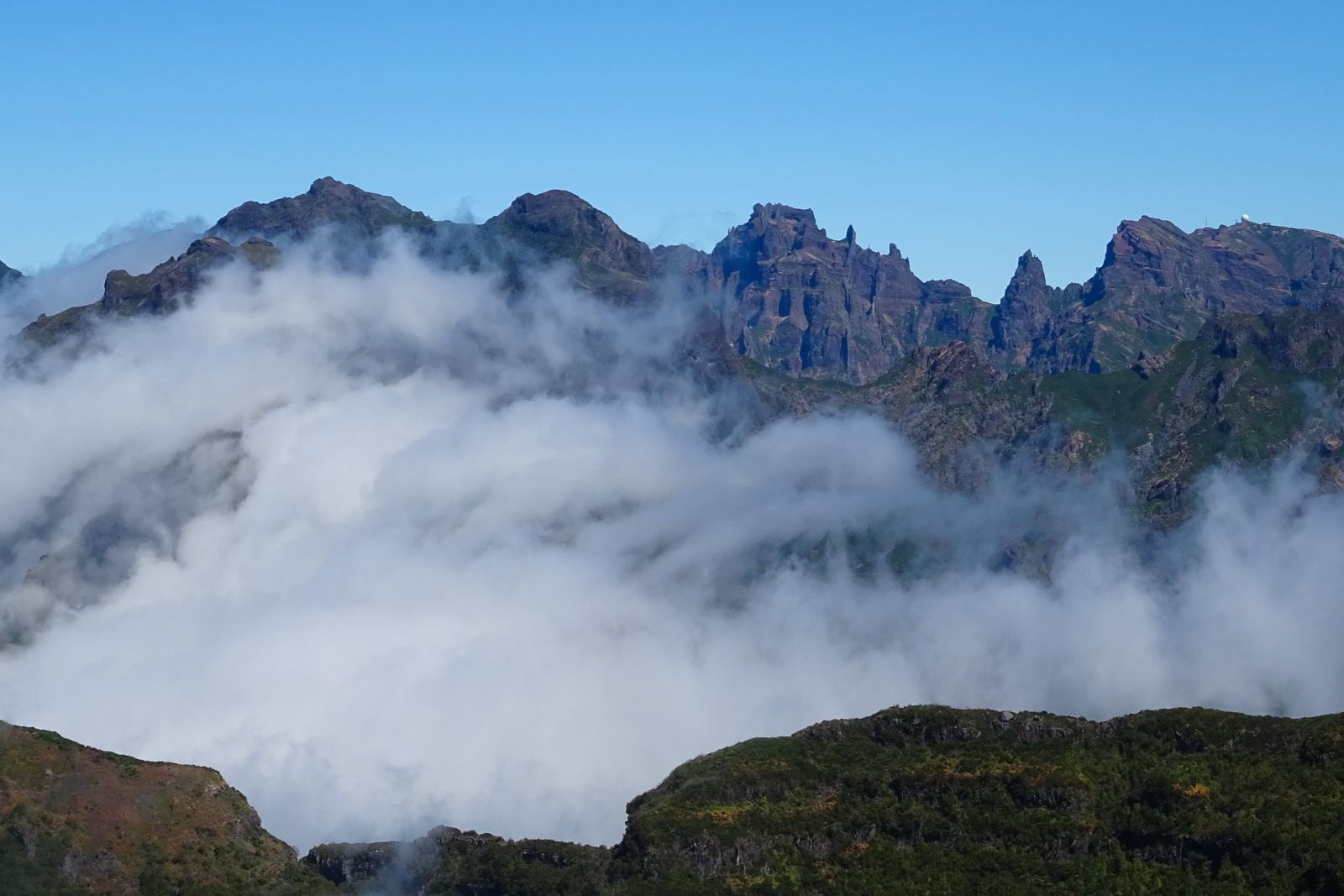 The Pico do Arieiro and Pico Ruivo ridges rising out of a sea of cloud