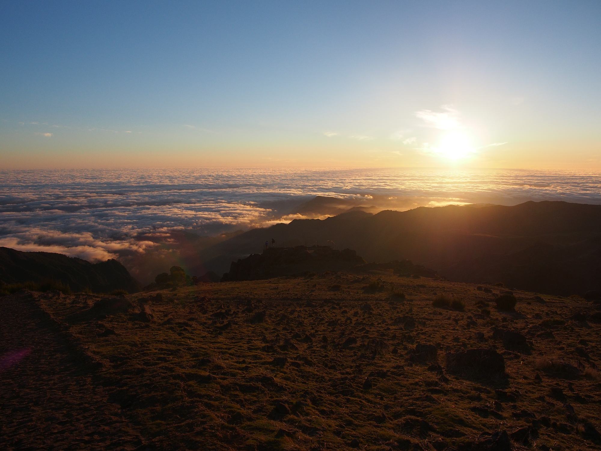 The sun rising over a sea of cloud, seen from the summit of Pico do Arieiro